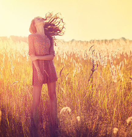 Beauty Girl Outdoor. Teenage Model Girl Posing in Sun Light