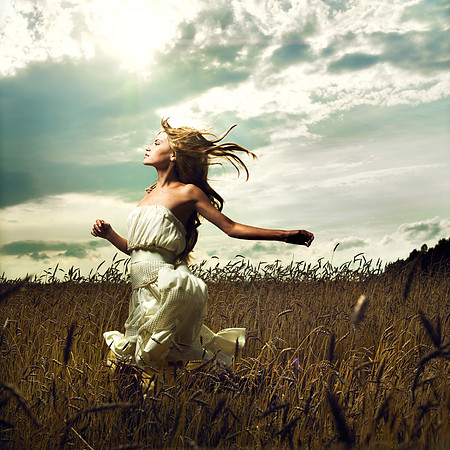 Girl running across field
